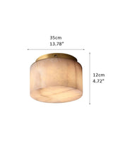 Round Alabaster flush mount ceiling light in brass frame for bedroom